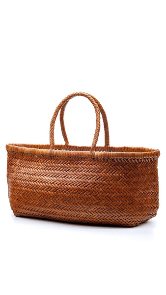 This is the bigger version of Dragon Diffusion’s iconic, best-selling bag — a roomy, hand-woven basket in smooth, buffalo calf leather. Handcrafted by artisan weavers in one piece, the diagonal chevron weave is what makes this style unique. And, remaining true to traditional basket weaving techniques, the bag comes unlined with an open top. Ideal for your next beach outing or a trip to your local market.