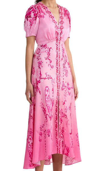 A signature Saloni shape, the Lea dress is a wardrobe favourite. Its beautifully realised bias cut flatters the figure, allowing the fabric to glide around the body for effortless and graceful movement. The exquisite pink floral print placement features tonal pink decorative frames and floral clusters that flow effortlessly over a delicate ombre ground. This dress is a romantic and contemporary wardrobe hero for all your summer occasions.
100% silk.