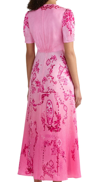 A signature Saloni shape, the Lea dress is a wardrobe favourite. Its beautifully realised bias cut flatters the figure, allowing the fabric to glide around the body for effortless and graceful movement. The exquisite pink floral print placement features tonal pink decorative frames and floral clusters that flow effortlessly over a delicate ombre ground. This dress is a romantic and contemporary wardrobe hero for all your summer occasions.
100% silk.