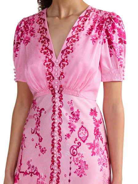 A signature Saloni shape, the Lea dress is a wardrobe favourite. Its beautifully realised bias cut flatters the figure, allowing the fabric to glide around the body for effortless and graceful movement. The exquisite pink floral print placement features tonal pink decorative frames and floral clusters that flow effortlessly over a delicate ombre ground. This dress is a romantic and contemporary wardrobe hero for all your summer occasions.
100% silk.