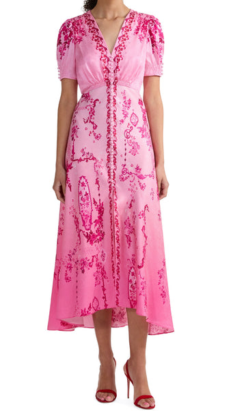 A signature Saloni shape, the Lea dress is a wardrobe favourite. Its beautifully realised bias cut flatters the figure, allowing the fabric to glide around the body for effortless and graceful movement. The exquisite pink floral print placement features tonal pink decorative frames and floral clusters that flow effortlessly over a delicate ombre ground. This dress is a romantic and contemporary wardrobe hero for all your summer occasions.
100% silk.