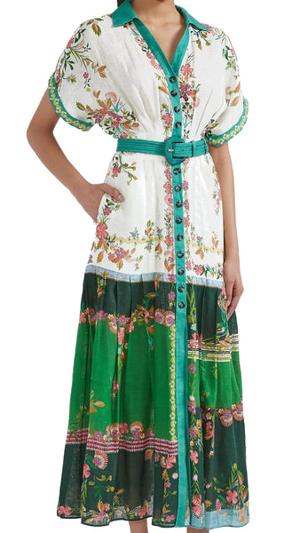 The Saloni Riya B is an elegant shirt dress with a cinched waist and a softly pleated full skirt. Delicate and eye-catching blossoms on a white and green colour-blocked background evoke the charm of Italian gardens and rose-strewn pergolas. Designed and cut to be cool and comfortable in the hottest weather, this linen dress, with its elevated detailing, is perfect for all events.