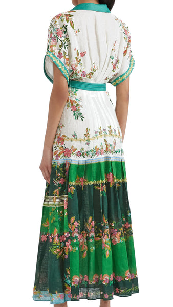 The Saloni Riya B is an elegant shirt dress with a cinched waist and a softly pleated full skirt. Delicate and eye-catching blossoms on a white and green colour-blocked background evoke the charm of Italian gardens and rose-strewn pergolas. Designed and cut to be cool and comfortable in the hottest weather, this linen dress, with its elevated detailing, is perfect for all events.