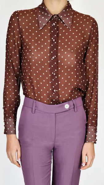 This classic polka dot button up shirt features a sheer plum colour that exudes sophistication and style. Elevate your wardrobe with this must-have piece that effortlessly transitions from day to night. 