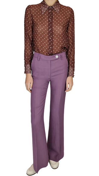 This classic polka dot button up shirt features a sheer plum colour that exudes sophistication and style. Elevate your wardrobe with this must-have piece that effortlessly transitions from day to night. 