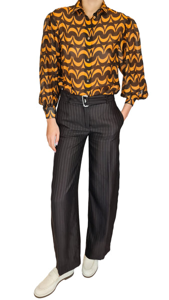 Experience a modern take on retro with this True Royal blouse. Made with sheer silky material, this top features a sweet print in rich brown and soft orange, and adds dimension with voluminous sleeves.