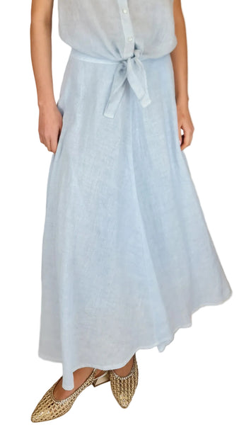 Light blue dress with a belt worn by a person on a beige background