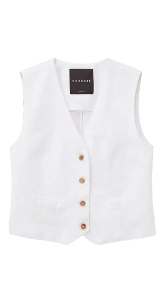 White vest with brown buttons on a beige background