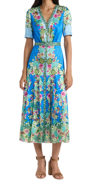 Woman wearing a floral dress with a blue background