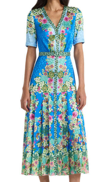 Woman wearing a floral dress on a white background