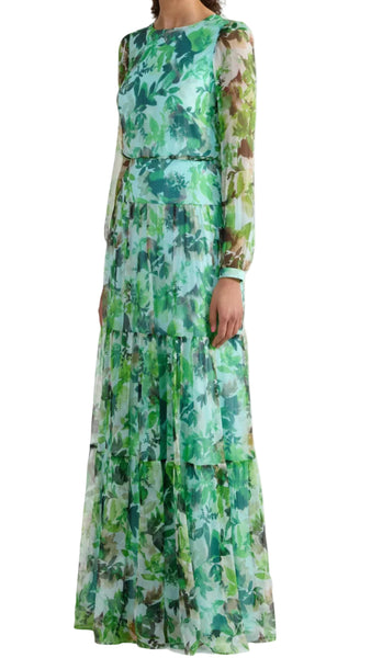 Woman wearing a green floral dress on a white background