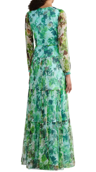 Woman wearing a long floral dress on a white background