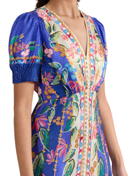 Colorful embroidered dress with a floral pattern on a white background