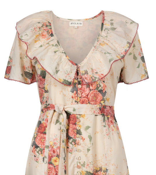 Floral dress with ruffled details on a white background