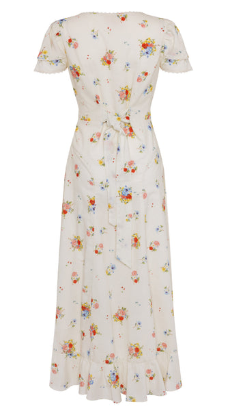 White dress with colorful floral pattern on a white background