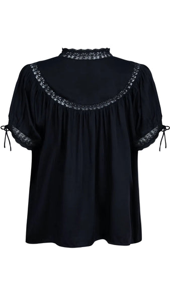 Black blouse with lace details on a white background