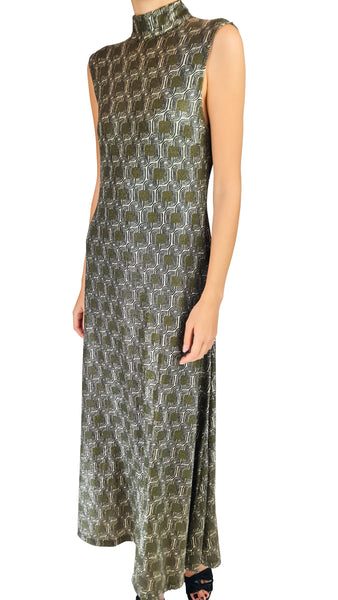 Make a glowing statement in the Siyu Tempo Lurex High-Neck Maxi Dress. Featuring a metallic geometric jacquard pattern, sleek mock neck, and an elegant sleeveless maxi silhouette for formal events.