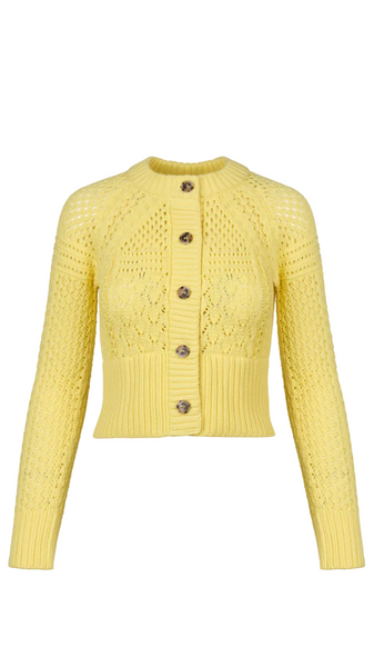 Yellow knitted cardigan with button details on a white background