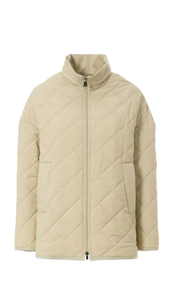 Beige quilted jacket on a white background