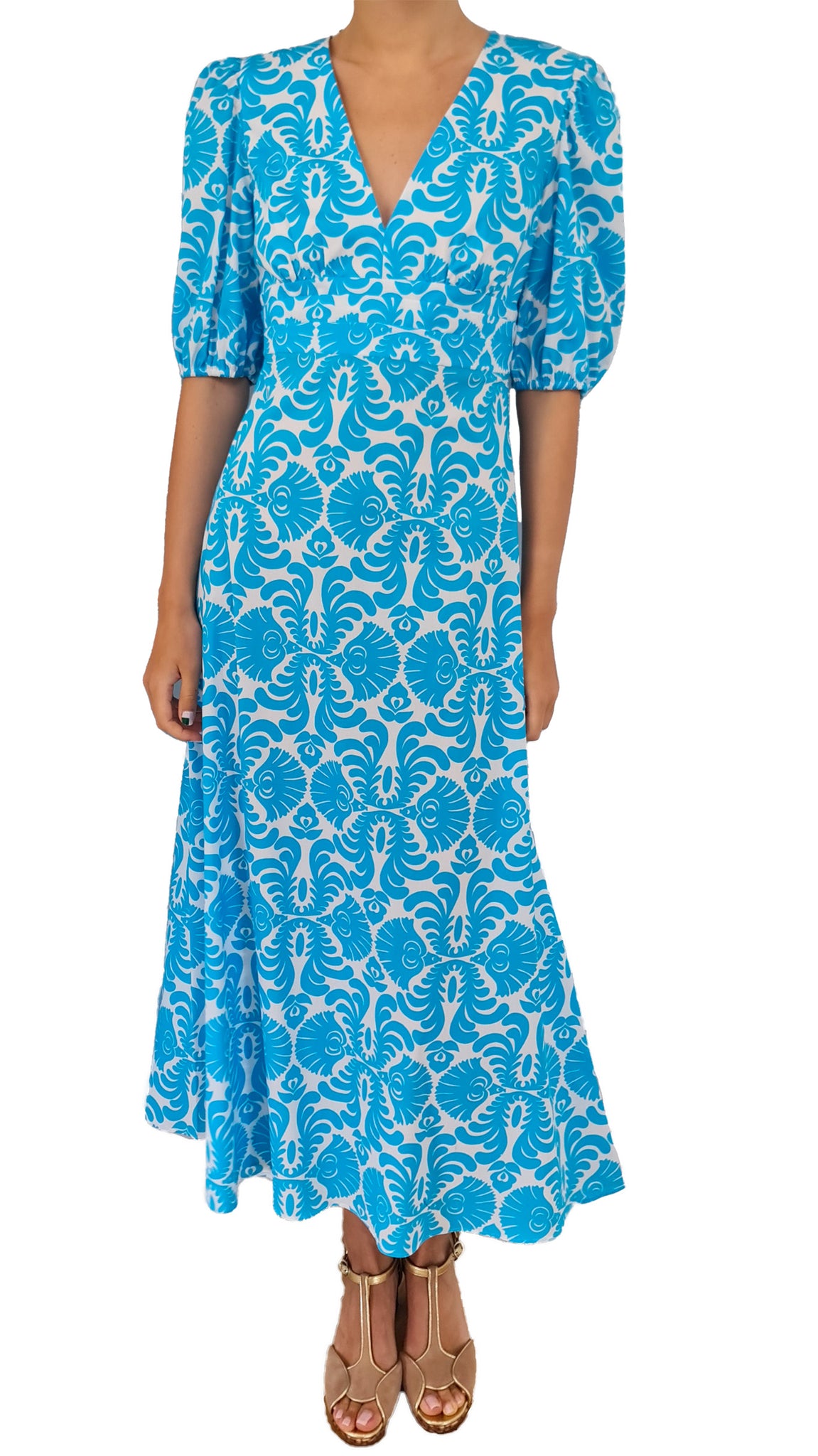 Elevate your summer style with this Caliban dress. Featuring an elegant, easy-to-wear design and a bold, eye-catching print, this dress is perfect for any occasion. Dress it up or down, this versatile piece will be an essential addition to your wardrobe. Make a statement and turn heads with this must-have piece!