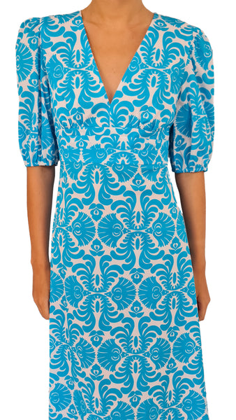 Elevate your summer style with this Caliban dress. Featuring an elegant, easy-to-wear design and a bold, eye-catching print, this dress is perfect for any occasion. Dress it up or down, this versatile piece will be an essential addition to your wardrobe. Make a statement and turn heads with this must-have piece!