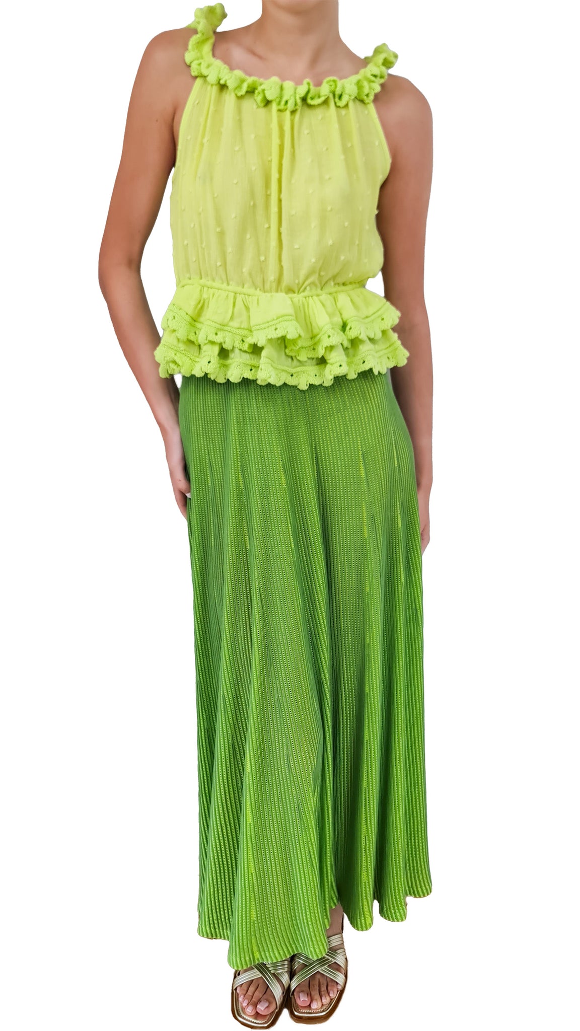 This fun lime green ruffle top adds a pop of colour and playful flair to any outfit. Stand out from the crowd and exude confidence with this stylish and eye-catching piece.