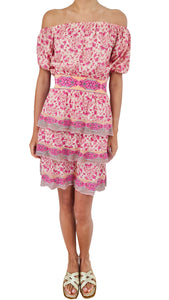 Experience the ultimate summer romance with this Cecilia Prado dress. Sweet and feminine, this tiered mini dress is your go-to for your holiday adventures. Adorned with a beautiful pink floral pattern, it's a dreamy addition to your wardrobe. Get ready to turn heads and make memories in this stunning dress!