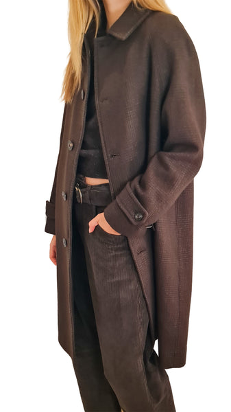 A woman wearing a dark brown textured coat over a black outfit
* Circolo wool coat
* Circolo 1901 brown wool plaid coat
* Women's single-breasted brown wool coat
* Circolo 1901 raglan sleeve wool coat
* Brown Glen check wool outerwear women
* Luxury Italian brown wool coat
* Tailored knee-length brown plaid coat
* Designer brown micro check wool coat