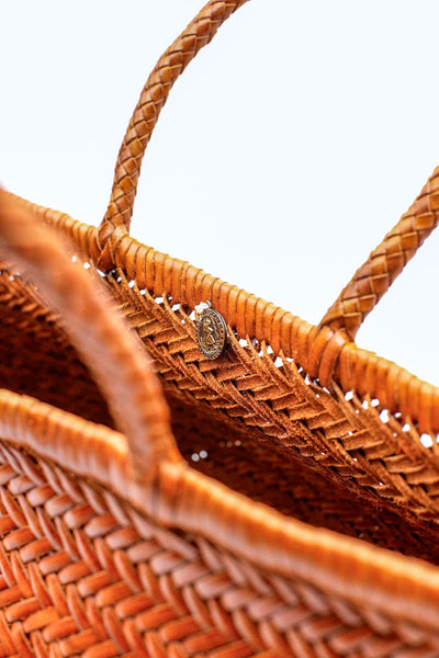 This is the bigger version of Dragon Diffusion’s iconic, best-selling bag — a roomy, hand-woven basket in smooth, buffalo calf leather. Handcrafted by artisan weavers in one piece, the diagonal chevron weave is what makes this style unique. And, remaining true to traditional basket weaving techniques, the bag comes unlined with an open top. Ideal for your next beach outing or a trip to your local market.