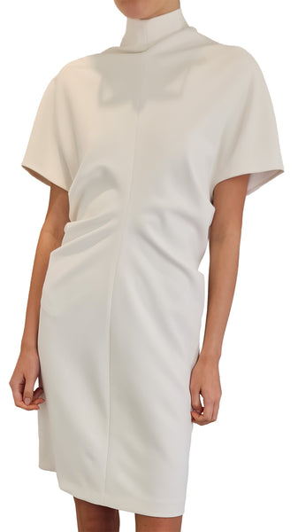 A model wearing a short-sleeved, high-neck dress in a warm off-white or cream color
* F.it Victoria cream short dress
* F.it Victoria high neck dress
* Women's cream short draped dress
* F.it Victoria off-white mini dress High neck short sleeve dress cream
* Ruched waist cream cocktail dress
* Designer cream high neck short dress
* Minimalist off-white stand collar dress