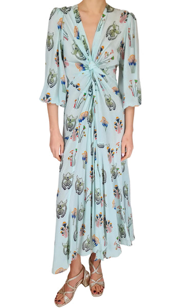 Woman wearing a floral dress with a plain background