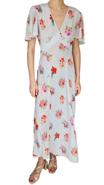 Woman wearing a floral dress on a white background