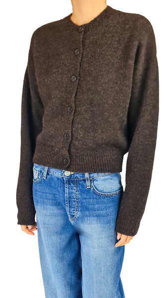 A person wearing a dark brown button-front knit cardigan sweater with blue jeans

chocolate brown alpaca cardigan • women's suri alpaca virgin wool sweater • fuzzy brown button front cardigan • luxurious crew neck knit sweater • soft alpaca blend knitwear