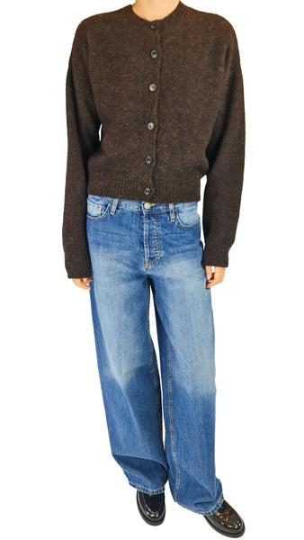A model wearing a dark brown button-up cardigan sweater and wide-leg blue jeans

chocolate brown alpaca cardigan • women's suri alpaca virgin wool sweater • fuzzy brown button front cardigan • luxurious crew neck knit sweater • soft alpaca blend knitwear