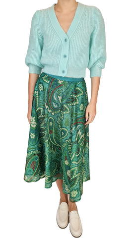 This midi skirt features a sparkly green paisley print that will make you stand out. Add a touch of whimsy to your wardrobe and shine bright in this statement piece. Perfect for any occasion, this skirt will have you feeling confident and stylish.