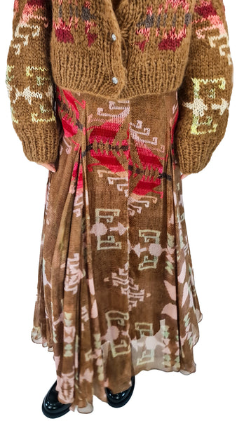 Mes Demoiselles Alma Printed Maxi Skirt | Luxury Bohemian Skirt   
 Elevate your wardrobe with the Mes Demoiselles Alma Printed Maxi Skirt. Featuring a fluid geometric pattern, handkerchief hem, and bohemian elegance.   
Mes Demoiselles Alma skirt, printed bohemian maxi skirt, luxury graphic print maxi skirt, designer patterned long skirt, brown geometric maxi skirt