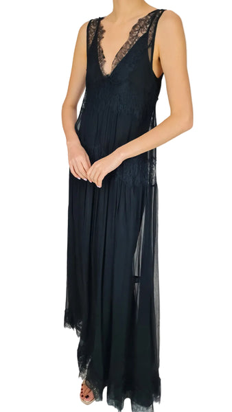 Black dress with lace detailing on a plain background