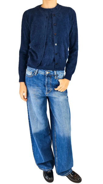 A model wearing a dark navy blue button-up cardigan and wide-leg faded blue jeans, paired with black leather shoes
Purotatto brushed cashmere top, navy brushed cashmere top, women's navy cashmere sweater   
Purotatto navy short sleeve top, luxury brushed cashmere crewneck, Italian navy cashmere knitwear    
Soft navy cashmere top, elegant women's cashmere base layer, premium brushed cashmere knit