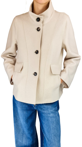 A person wearing a light beige cropped jacket with a stand collar and dark buttons, paired with blue jeans

Rosso35 women's outerwear

Italian boiled wool jacket women

Cream stand collar wool jacket

Cream button front wool jacket

Rosso35 fitted outerwear

Tailored cream wool jacket for women

Elegant cream autumn jacket

