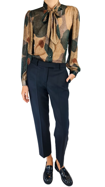 A model wearing a long-sleeve, high-neck blouse with a brown and green abstract botanical pattern and a tie collar, paired with black trousers and black leather loafers
* True Royal black virgin wool trousers
* True Royal tailored black wool pants Women's black virgin wool dress pants
* True Royal black tailored trousers women Premium black virgin wool cropped pants
* High-end black straight leg wool trousers
* True Royal Italian wool work trousers
* Elegant black ankle length wool pants