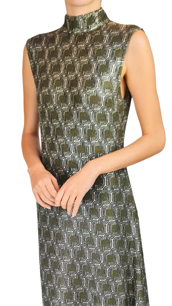A sleeveless high-neck dress with a metallic geometric pattern in olive green, silver, and black, shown on a model against a white background. Siyu Tempo dress, lurex high neck maxi dress, metallic sleeveless evening gown, designer geometric jacquard dress, luxury green gold formal dress.