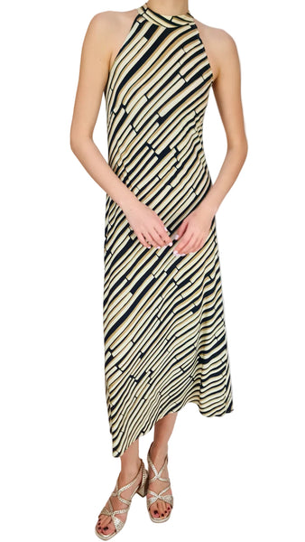 Woman wearing a black and white striped dress on a white background