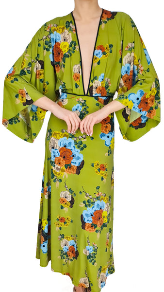 Woman wearing a green floral robe on a white background