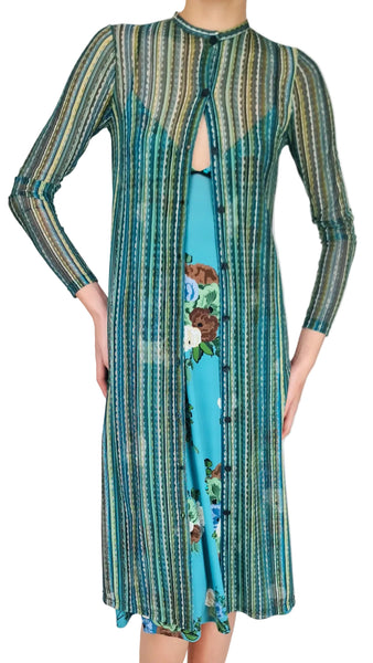 Long-sleeve dress with a patterned top and solid blue bottom on a gray background