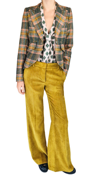 A model wearing a cropped plaid blazer in green, orange, and beige tones, paired with wide-leg mustard yellow corduroy trousers and a patterned tie, set against a plain white background.
mustard yellow wide-leg corduroy pants • high-waisted corduroy trousers • women's flared corduroy pants • 70s style corduroy co-ord pants