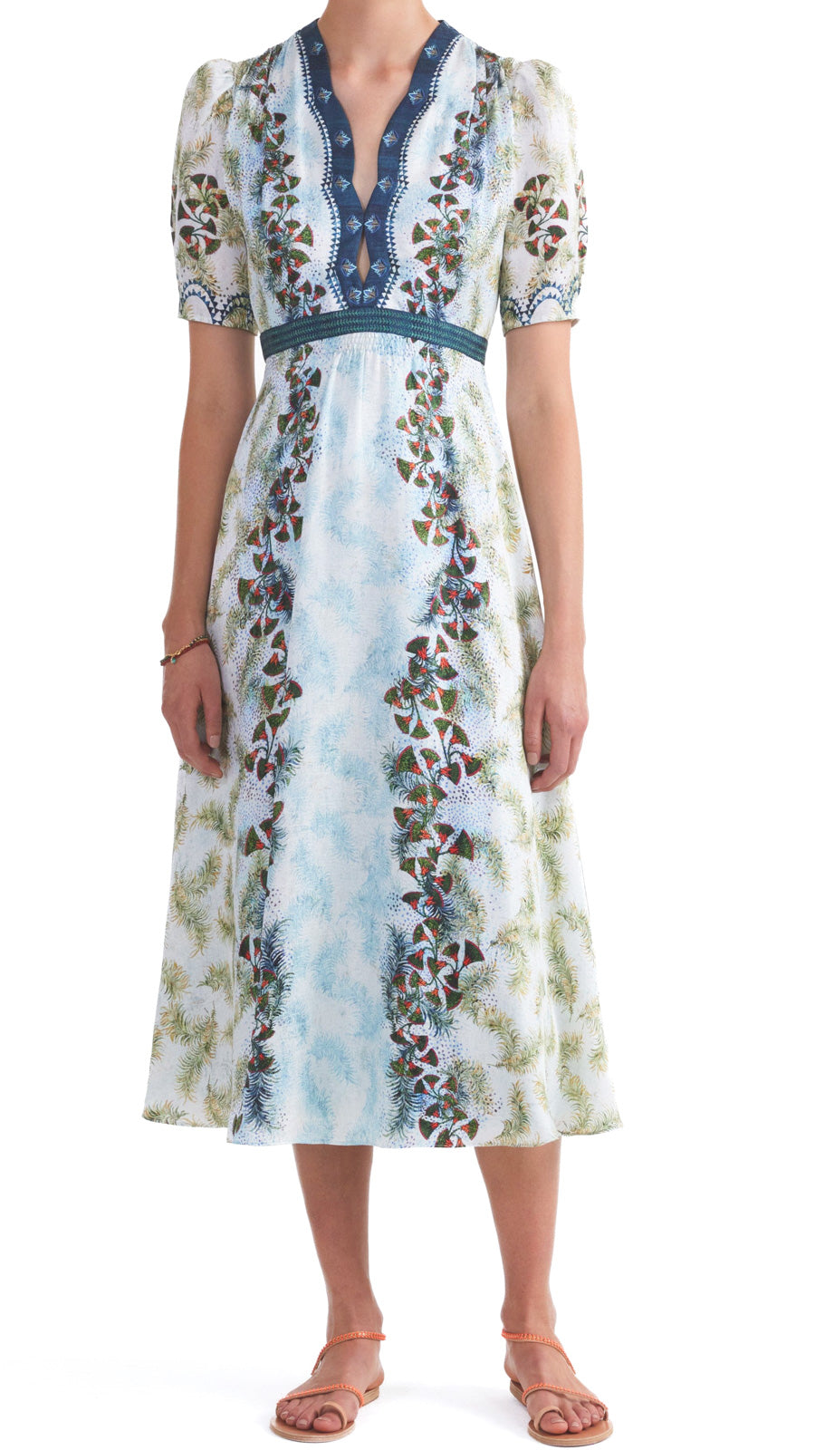 This midi-length Saloni dress features a keyhole neckline, smocking bodice details, and short puff sleeves with smocked cuffs. The fitted waist flatters your figure while the feather papyrus print adds a touch of uniqueness. Elevate your style with this exquisite dress!  100% silk. Dry clean.