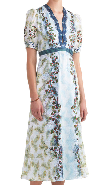 This midi-length Saloni dress features a keyhole neckline, smocking bodice details, and short puff sleeves with smocked cuffs. The fitted waist flatters your figure while the feather papyrus print adds a touch of uniqueness. Elevate your style with this exquisite dress!  100% silk. Dry clean.