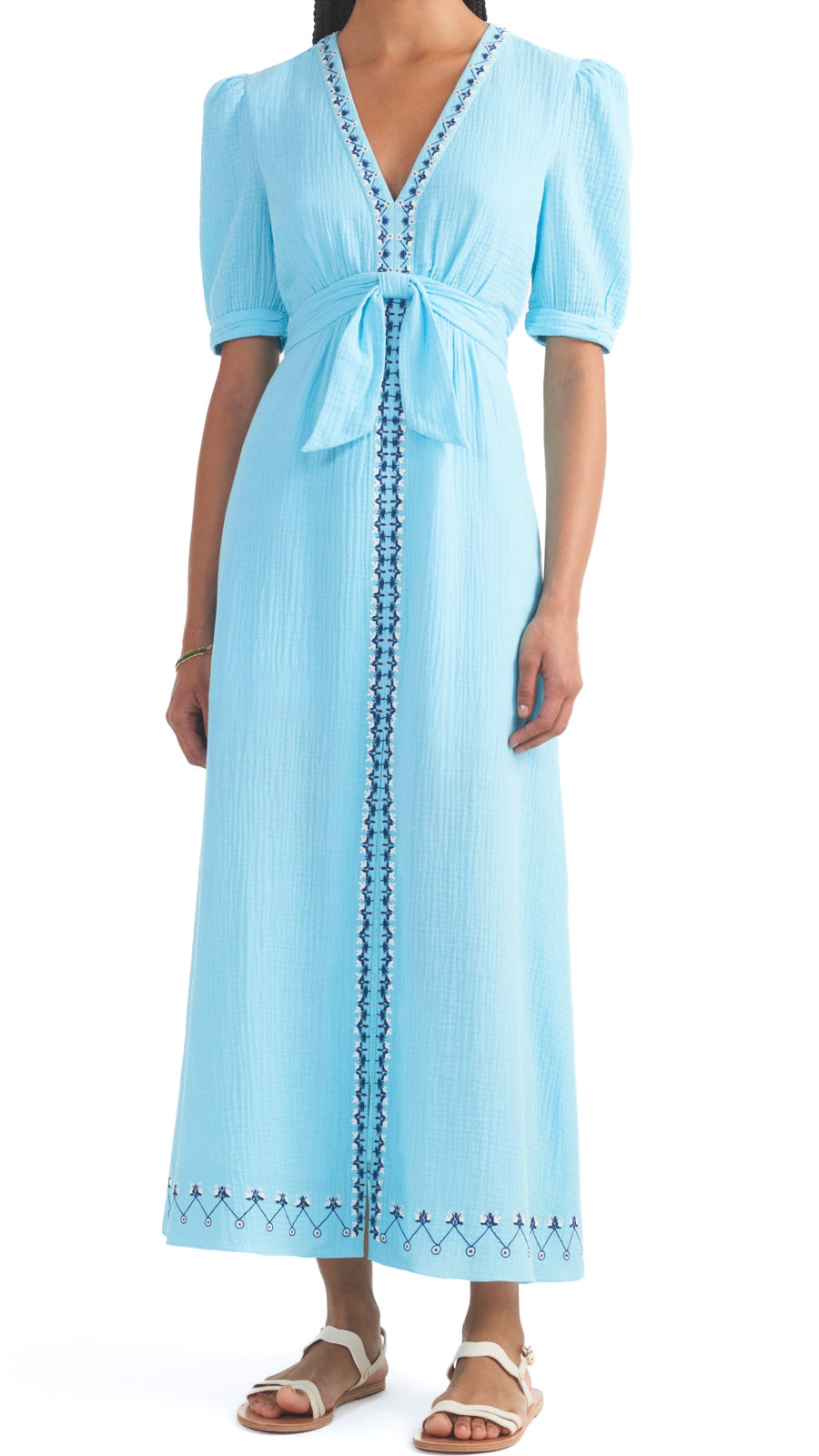 This stunning cotton dress features a fitted waist for a flattering silhouette and a v-neckline for added elegance. The textured cotton fabric adds a touch of fun while the beautiful cloud blue colour will make you stand out in any crowd.  100% cotton. Dry clean.