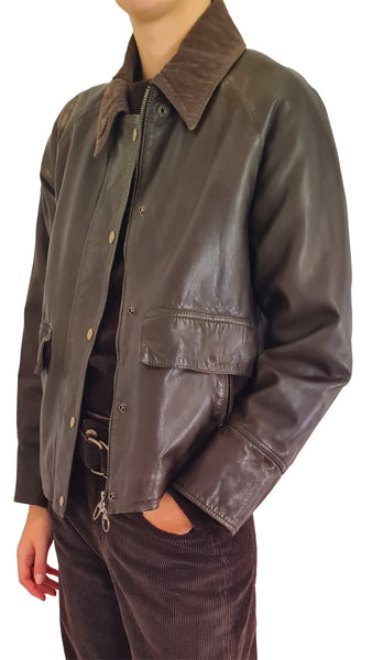 A person wearing a dark brown leather jacket with a contrasting brown corduroy collar, paired with dark brown corduroy pants
The Jackie Leathers Glamis leather jacket
The Jackie Leathers dark brown leather jacket
Women's dark brown leather utility jacket
Dark brown leather jacket with suede collar
Italian leather bomber jacket with ring pull
Luxury dark brown leather outerwear women
Designer leather jacket with snap flap pockets
The Jackie Leathers Glamis brown leather coat