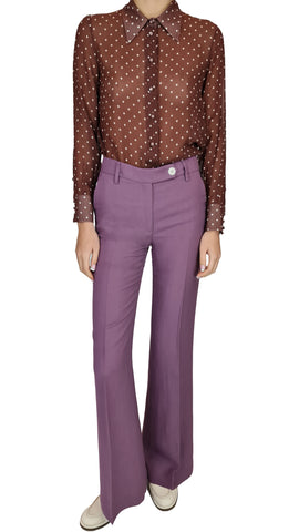This classic polka dot button up shirt features a sheer plum colour that exudes sophistication and style. Elevate your wardrobe with this must-have piece that effortlessly transitions from day to night.&nbsp;